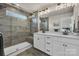 Sleek bathroom features double vanity, glass shower with seat and modern fixtures at 16764 Summers Walk Blvd, Davidson, NC 28036