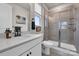 Modern bathroom featuring a tiled shower, a quartz countertop, and updated fixtures at 16764 Summers Walk Blvd, Davidson, NC 28036