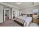 Comfortable bedroom featuring plush carpeting, natural lighting, and views of outdoors at 16764 Summers Walk Blvd, Davidson, NC 28036