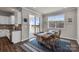 Bright dining area adjacent to the kitchen and featuring a sliding glass door to the outside deck at 16764 Summers Walk Blvd, Davidson, NC 28036