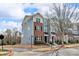Townhome exteriors showcase varied siding and brick details, complemented by manicured landscaping at 16764 Summers Walk Blvd, Davidson, NC 28036