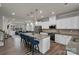 Modern kitchen with stainless steel appliances, a granite countertop island and hanging lights at 16764 Summers Walk Blvd, Davidson, NC 28036