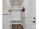 Mudroom with white cabinet and coat rack with a dark wood floor at 16764 Summers Walk Blvd, Davidson, NC 28036