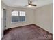 Bright bedroom featuring a ceiling fan, a window and neutral walls at 225 Howe St, Belmont, NC 28012