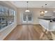 Bright dining area with hardwood floors, large windows, and easy access to the kitchen at 225 Howe St, Belmont, NC 28012