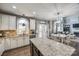 Large kitchen with granite counters, stainless appliances and open floor plan to Gathering room at 2317 Barrington Ridge Dr, Waxhaw, NC 28173