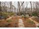 Extensive backyard featuring a stone pathway and landscaping with mature trees at 2622 Oakhurst Dr # 23, Rock Hill, SC 29730