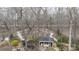 Aerial view of backyard retreat with winding paths, mature trees, and an outdoor shelter at 2622 Oakhurst Dr # 23, Rock Hill, SC 29730