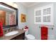 Well-lit bathroom with a large window, neutral colors, and a vanity with granite countertop and a window with shutters at 2622 Oakhurst Dr # 23, Rock Hill, SC 29730