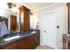 Bathroom featuring a double vanity with granite countertops and ample storage space, plus a separate mirror at 2622 Oakhurst Dr # 23, Rock Hill, SC 29730