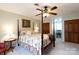 Spacious bedroom featuring a four-poster bed, ceiling fan, and neutral carpet at 2622 Oakhurst Dr # 23, Rock Hill, SC 29730