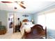 Cozy bedroom with light blue walls, a wooden bed, and a bright window at 2622 Oakhurst Dr # 23, Rock Hill, SC 29730