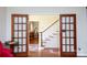 Foyer with hardwood floors, glass paneled doors, and staircase at 2622 Oakhurst Dr # 23, Rock Hill, SC 29730