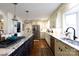 Bright kitchen with stainless steel appliances, stone countertops, and hardwood floors at 2622 Oakhurst Dr # 23, Rock Hill, SC 29730