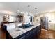 Open kitchen boasts granite counters, an island cooktop, stainless steel appliances, and hardwood floors at 2622 Oakhurst Dr # 23, Rock Hill, SC 29730