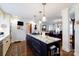 Open kitchen with granite island, stainless appliances, and hardwood floors at 2622 Oakhurst Dr # 23, Rock Hill, SC 29730