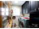 Well-equipped laundry room features built-in cabinetry, a window for natural light, and modern washer/dryer units at 2622 Oakhurst Dr # 23, Rock Hill, SC 29730