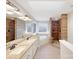 Luxurious bathroom with double sinks, a soaking tub, a tiled shower, and modern lighting at 2683 Beulah Church Rd, Matthews, NC 28104