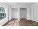 Bedroom featuring open closet with adjustable shelving and natural lighting at 2856 Summergrove Ct, Matthews, NC 28105