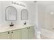 Bathroom features dual sinks, modern fixtures, and a tub with a shower at 3000 Misty Harbor Cir # A, Cramerton, NC 28032