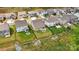 A clear aerial view shows manicured backyards, fencing, firepit, and neighboring homes, highlighting outdoor living at 3193 Burnello Ct, Iron Station, NC 28080