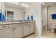 Bathroom with granite countertops, double sinks, and a tile floor leading to a separate toilet and shower area at 3193 Burnello Ct, Iron Station, NC 28080