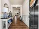 Inviting foyer with hardwood floors, wainscoting, and an elegant console table at 3193 Burnello Ct, Iron Station, NC 28080