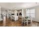 Spacious kitchen featuring a large island, stainless steel appliances, and hardwood floors at 3193 Burnello Ct, Iron Station, NC 28080