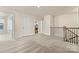 Loft area features neutral carpet, 3 doors, and a railing that looks to downstairs at 3193 Burnello Ct, Iron Station, NC 28080