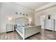 Bright main bedroom with blue accents, wood floors, and modern decor at 3193 Burnello Ct, Iron Station, NC 28080