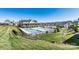 Community pool area with a large pool, sundeck, and clubhouse at 3193 Burnello Ct, Iron Station, NC 28080