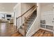A carpeted staircase with a dark railing is visible near the entry at 3193 Burnello Ct, Iron Station, NC 28080