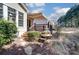 Charming backyard featuring a deck with awning and a decorative water feature, enhancing outdoor appeal at 41108 Calla Lily St, Fort Mill, SC 29707