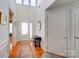 Bright foyer with hardwood floors, double doors, and decorative wainscoting at 41108 Calla Lily St, Fort Mill, SC 29707