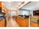Modern kitchen with stainless steel appliances and granite countertops, open to living areas at 41108 Calla Lily St, Fort Mill, SC 29707