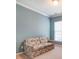 Small living room with blue walls and floral-patterned sofa at 41108 Calla Lily St, Fort Mill, SC 29707
