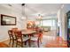 Open-concept living space with a dining area, fireplace, and views of the living room at 41108 Calla Lily St, Fort Mill, SC 29707
