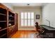Office features hardwood floors, built-in shelving, and a desk at 41108 Calla Lily St, Fort Mill, SC 29707