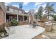 A beautiful brick home featuring a spacious patio with built-in grill and covered back porch for outdoor entertaining at 4421 Windwood Cir, Charlotte, NC 28226
