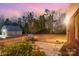 Backyard with a lush green lawn and outdoor grill area, perfect for outdoor entertaining and relaxing at 4421 Windwood Cir, Charlotte, NC 28226