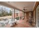 The home's covered back porch provides a relaxing outdoor space with access to the brick patio and backyard at 4421 Windwood Cir, Charlotte, NC 28226