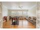 Bright bonus room features hardwood floors, a ceiling fan, and three large windows letting in lots of natural light at 4421 Windwood Cir, Charlotte, NC 28226