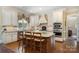 Kitchen featuring granite countertops, custom cabinets, a central island, and stainless steel appliances at 4421 Windwood Cir, Charlotte, NC 28226