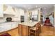 Spacious kitchen featuring a center island with seating, granite countertops, and stainless appliances at 4421 Windwood Cir, Charlotte, NC 28226