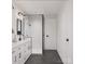Modern bathroom with a glass-enclosed shower, double vanity, and sleek black fixtures at 5128 Izzo Ln, Charlotte, NC 28214