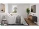 Cozy bedroom with a large window, light hardwood floors, and a calming color palette at 5128 Izzo Ln, Charlotte, NC 28214