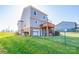 View of the home's back exterior featuring a wooden deck, a fenced yard, and manicured landscaping at 538 30Th Avenue Ne Cir, Hickory, NC 28601