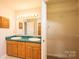 This bathroom includes double sinks, tile countertops and flooring, and access to a walk-in closet at 538 30Th Avenue Ne Cir, Hickory, NC 28601