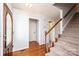 Inviting foyer with hardwood floors, a staircase, and natural light streaming through the front door at 538 30Th Avenue Ne Cir, Hickory, NC 28601