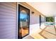 Inviting front porch featuring a decorative glass door, outdoor lighting, and a swing at 538 30Th Avenue Ne Cir, Hickory, NC 28601